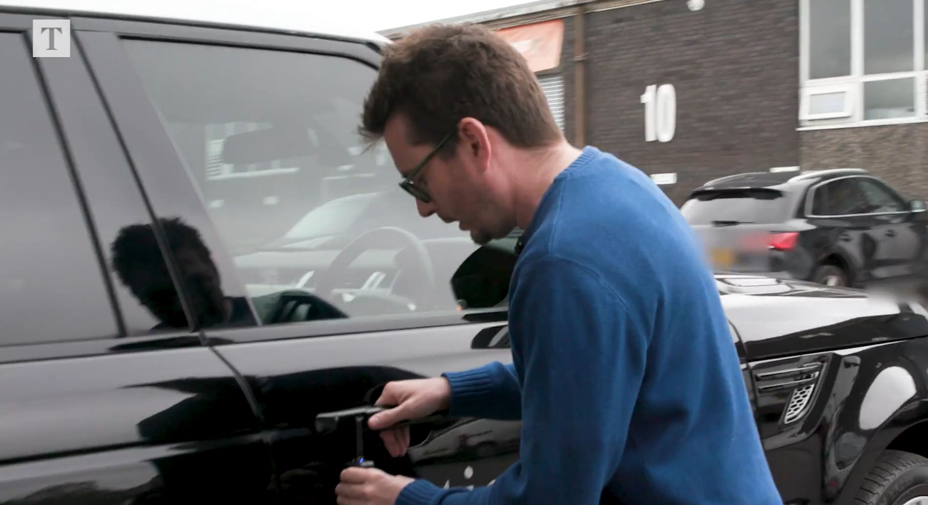 The blue LED light on the receiver in Clatworthy’s hand shows that a signal has been found